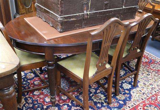 A George III style mahogany extending dining table and as set of six Hepplewhite style dining chairs W.180cm with leaf
